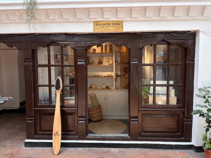 Eco Sathi Nepal's zero-waste store at Babar Mahal Revisited, with a giant bamboo toothbrush at the entrance